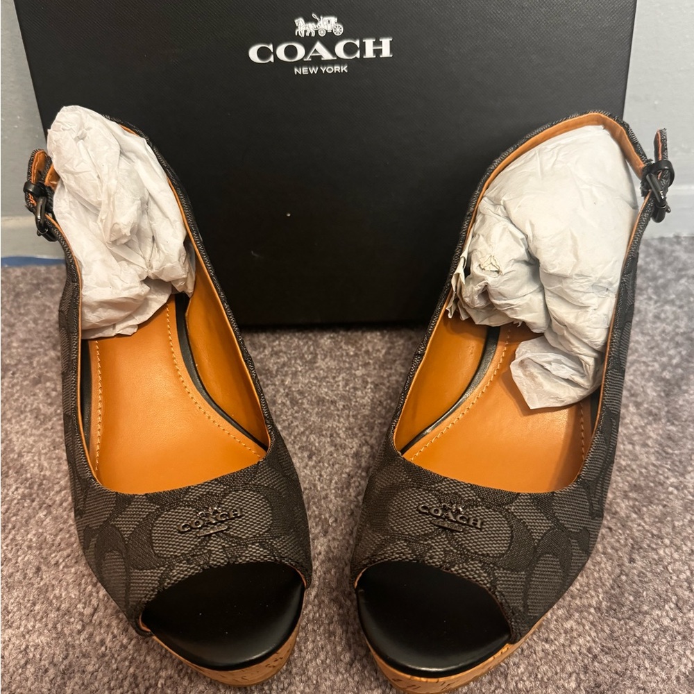 Black on black Coach wedges